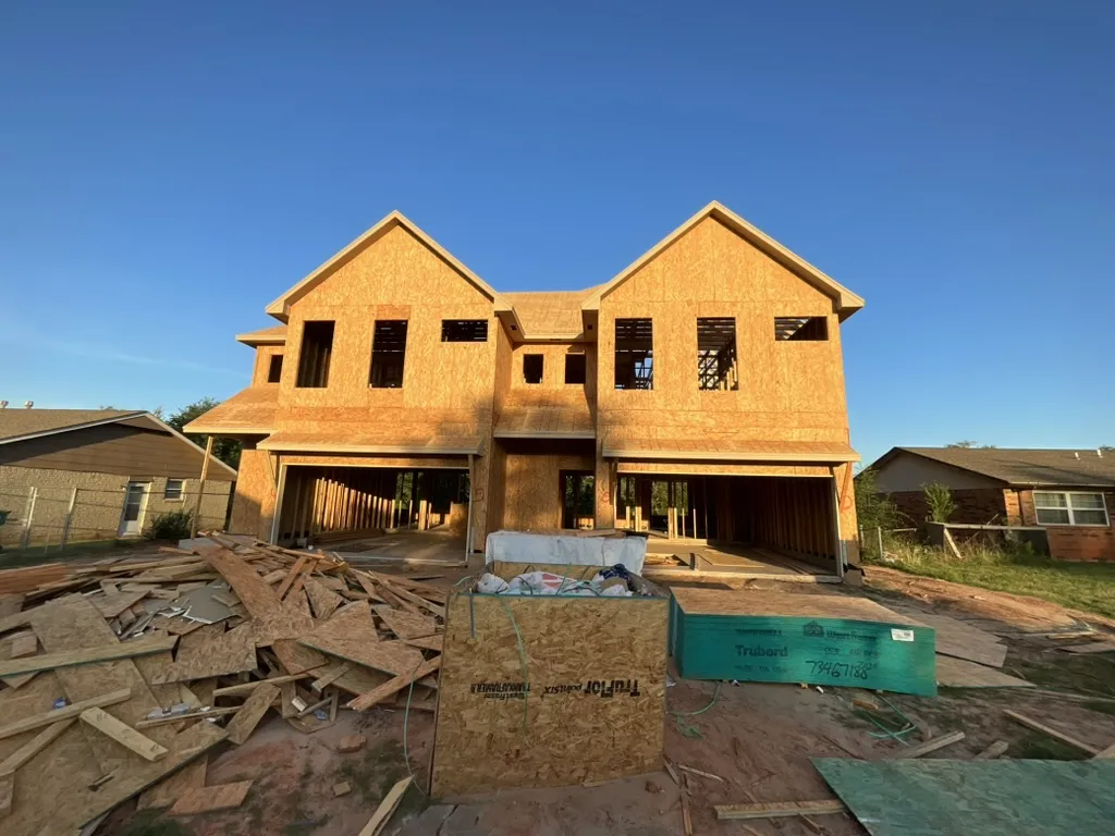 Before: the duplex framed and sheathed, mid-construction